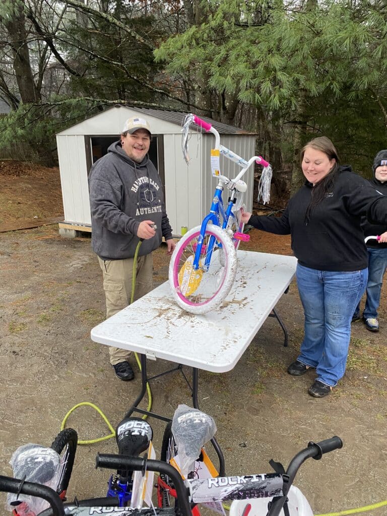 volunteers building bikes