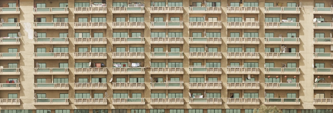 face of building showing dozens of balconies